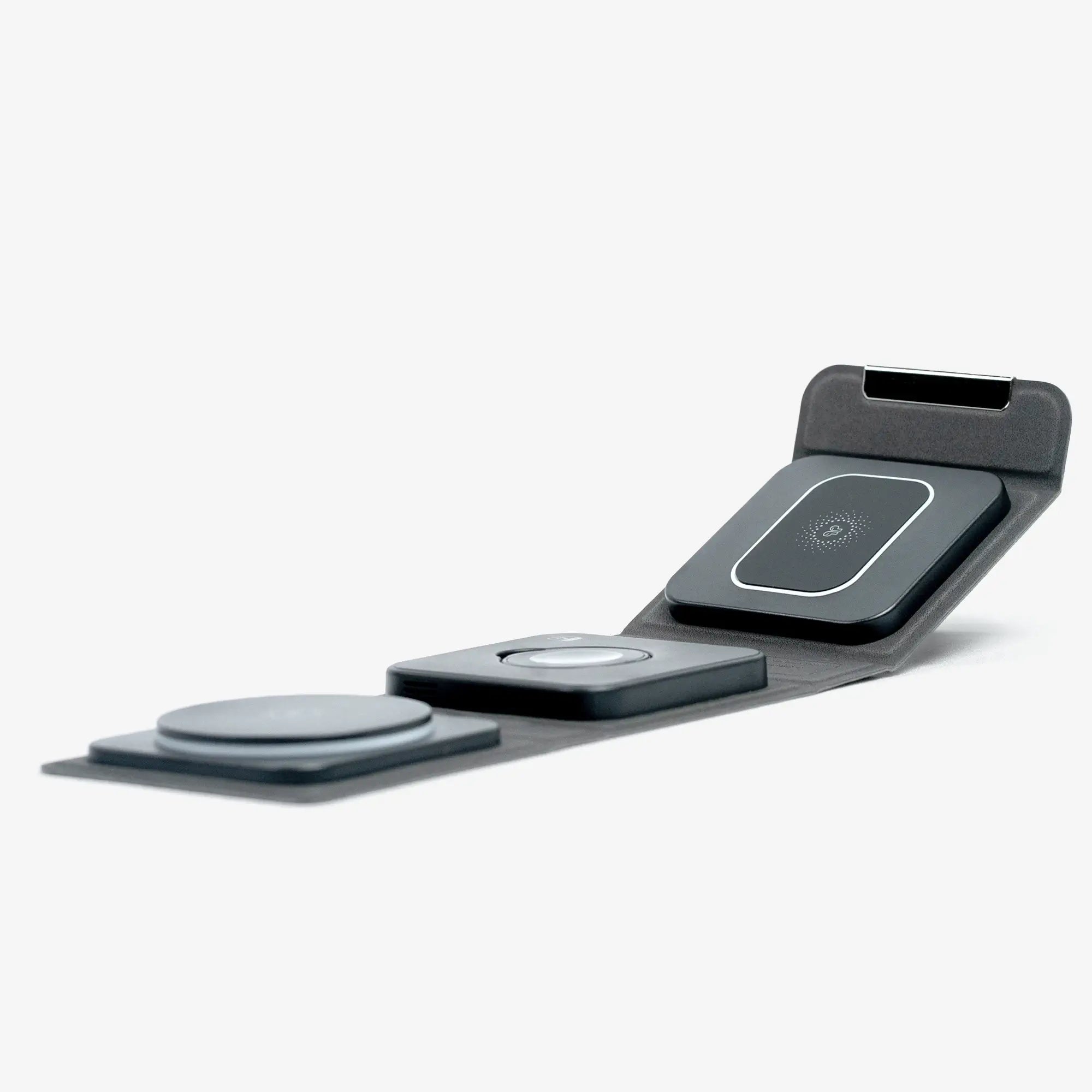 Cubica MagSafe-compatible charger, unfolded to show three charging pads for multi-device charging.
