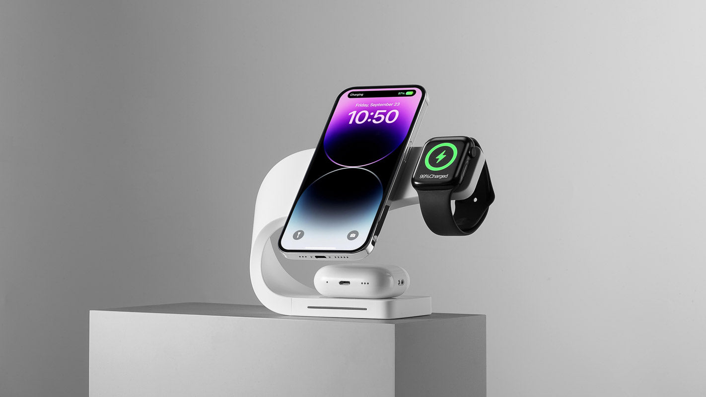 Modern Standard's MagSafe charging station in white, elegantly charging an iPhone, Apple Watch, and AirPods simultaneously, showcasing sleek design and advanced technology for efficient multi-device charging.