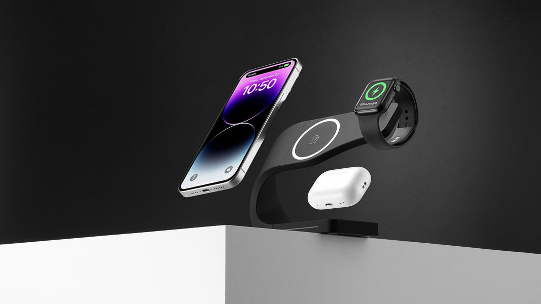 Modern Standard SIMPLI MagSafe charging station with iPhone, Apple Watch, and AirPods, showcasing sleek black design and functionality, backed by a 1-year warranty for reliable performance.
