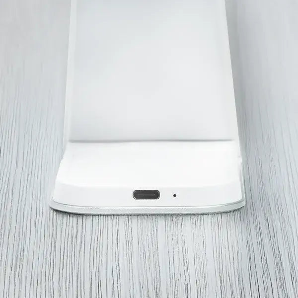 White Magnitis MagSafe charging stand base with USB-C port on gray background, designed for sleep-friendly bedside use