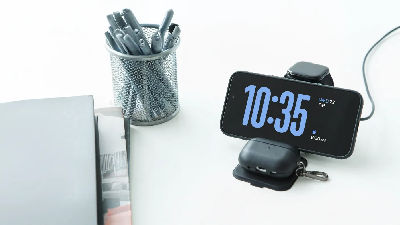 Modern Standard Origami MagSafe charging station on white desk with iPhone, Apple Watch, and AirPods