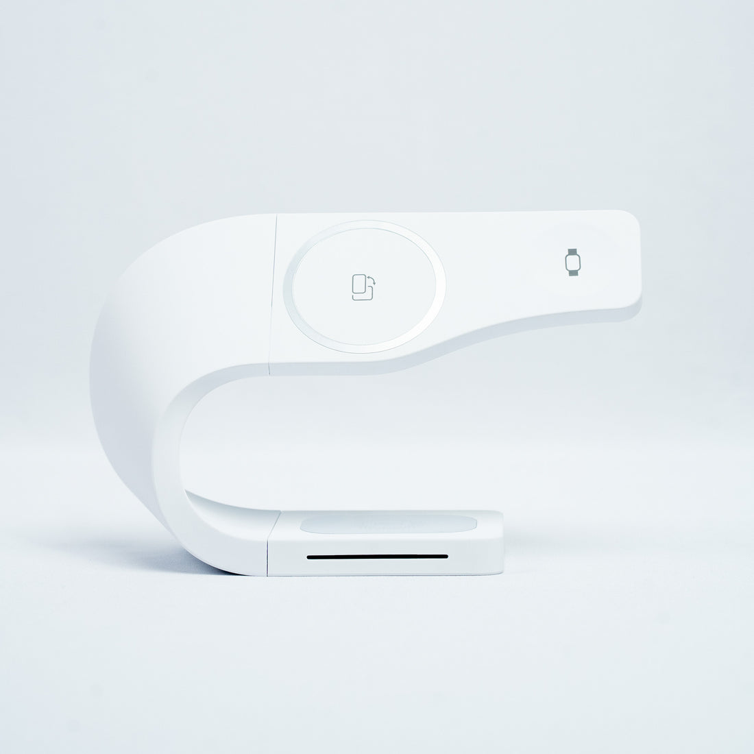 Simpli 3-in-1 Wireless Charging Station in Ivory White - a contemporary MagSafe compatible charging solution for iPhone, Apple Watch, and AirPods featuring a minimalist curved design in a clean white color.