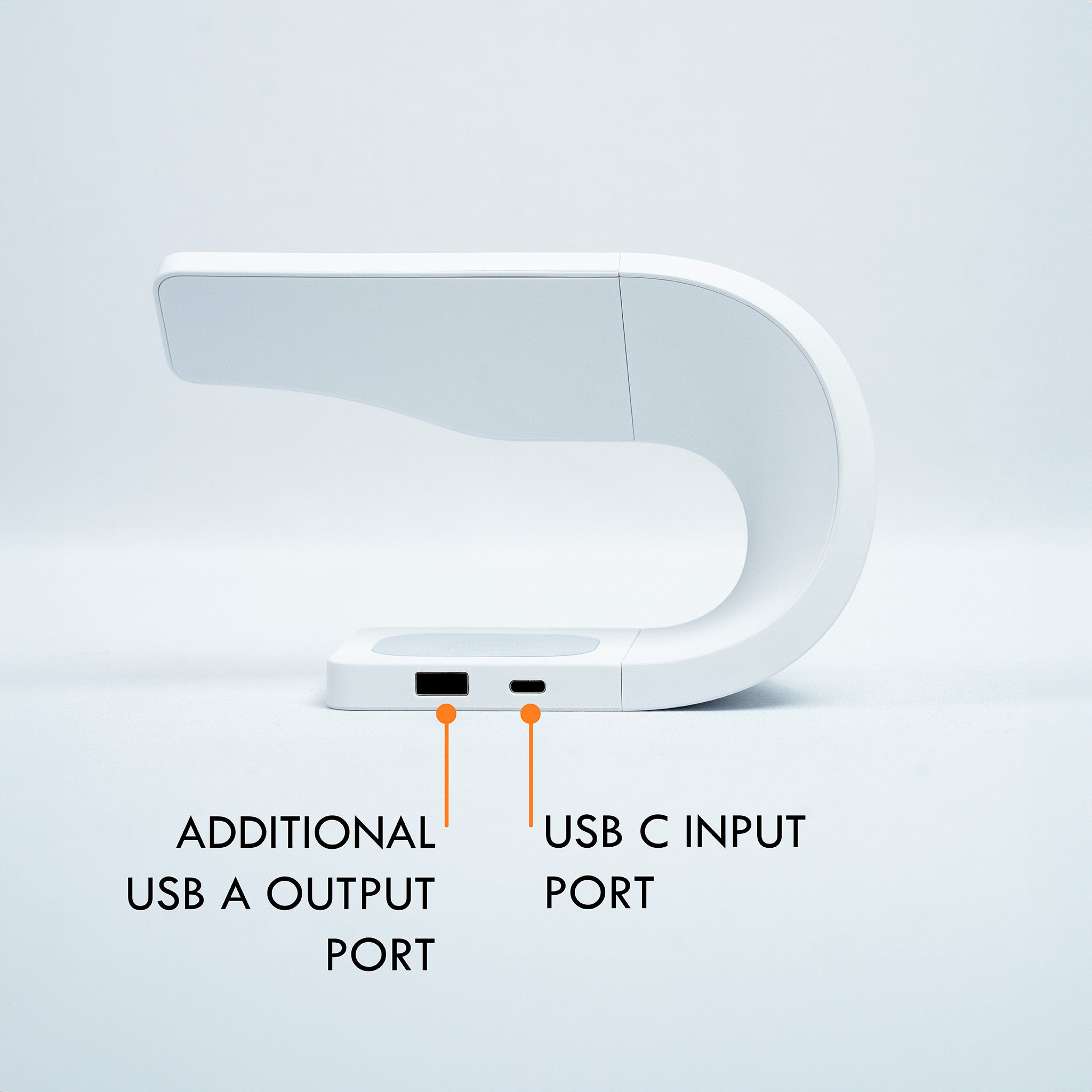 Close-up of the Simpli 3-in-1 Wireless Charging Station in Ivory White, highlighting the additional USB A output port and USB C input port labeled with orange markers.